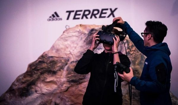 User using VR to experience climbing challenge from Adidas Terrex Campaign